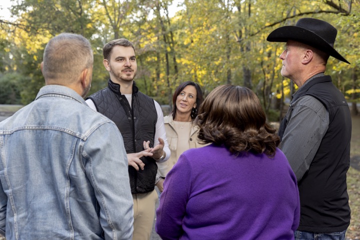 Garrett Collier speaking with residents